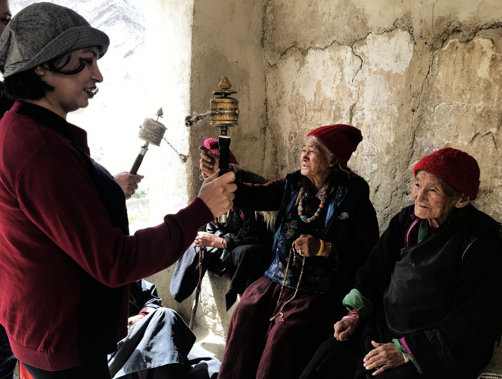Learning to use prayer wheel