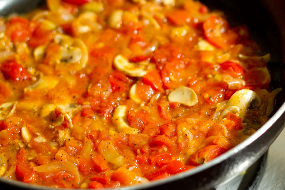 Eggs on tomato and mushroom bed Swati's Kitchen