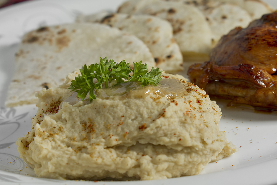 Hummus served with Pita Bread and Chicken Winglets.